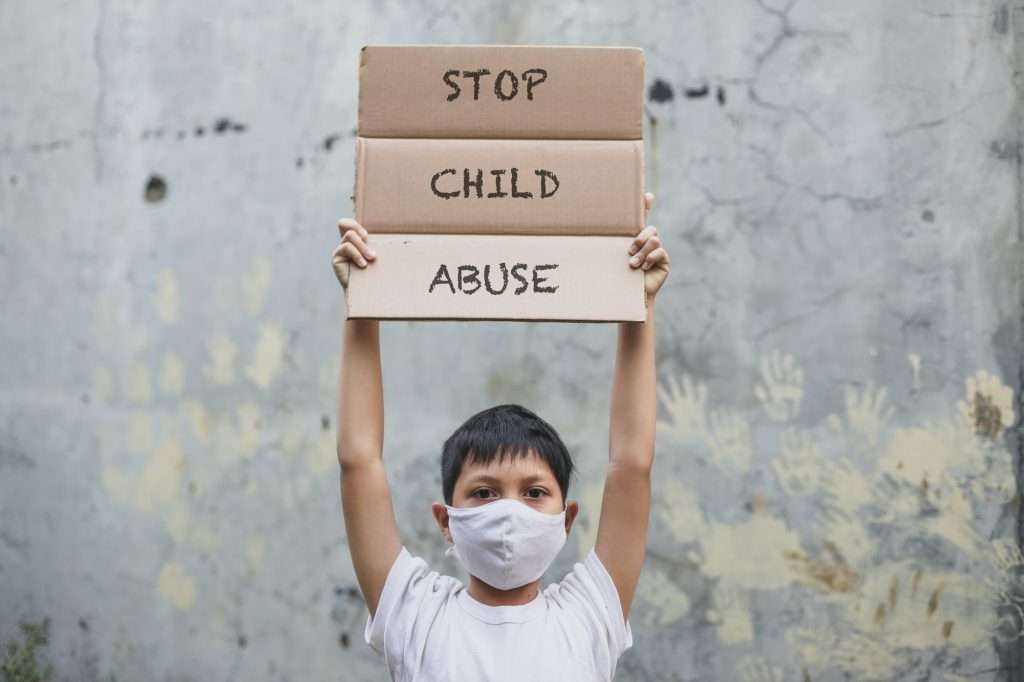 Child abuse protest by a boy